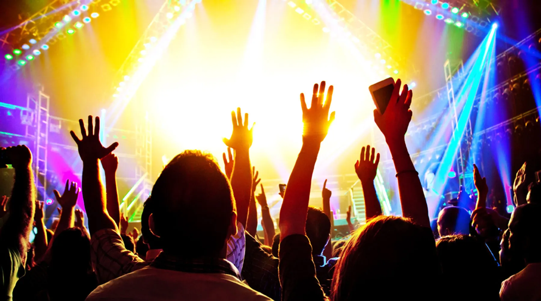 Hands raised at a live music concert